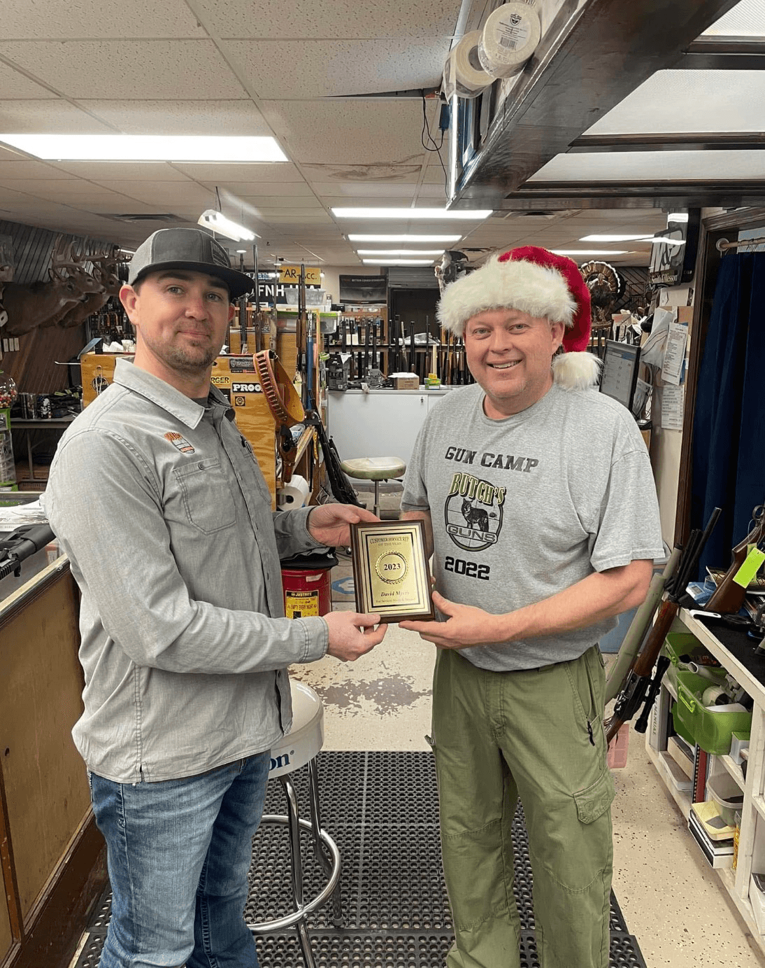 Butch's Guns business background image